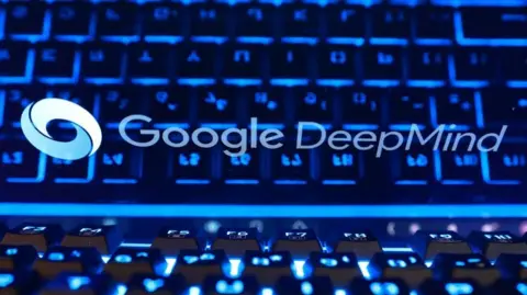 Reuters Stylized image of Google DeepMind logo on a screen with the blue lights of a keyboard reflecting on it.