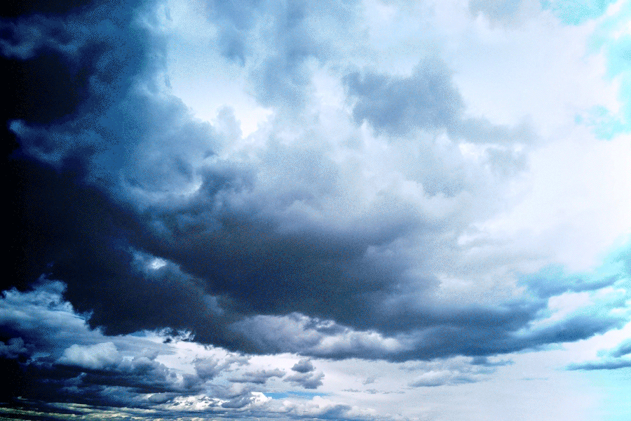 Blue and white stormy clouds fill the sky.
