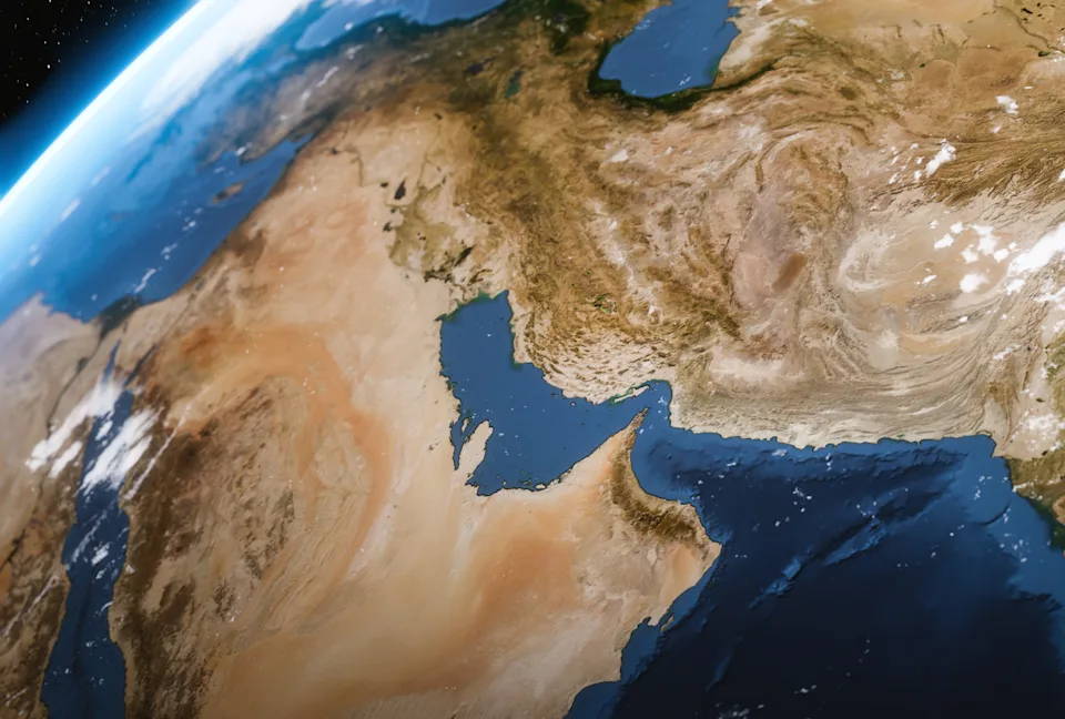 View of Earth's landscape from space, showing deserts, mountains, and bodies of water in the Middle East region