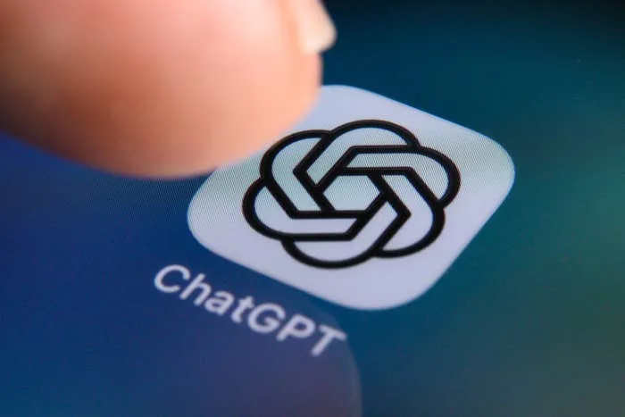 A finger tapping the ChatGPT app icon on a smartphone screen