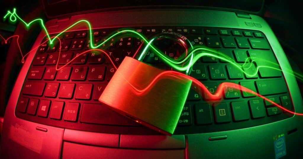 A padlock on a laptop keyboard, showing how churches can protect themselves from AI-powered cyber threats