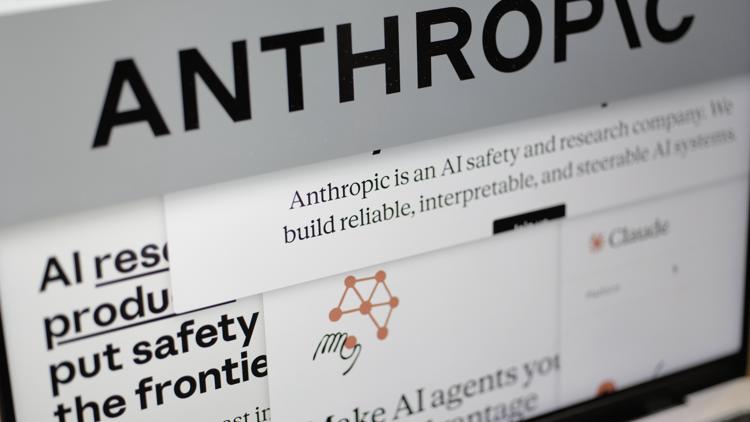 FILE - Pages from the Anthropic website and the company's logo are displayed on a computer screen on Feb. 26, 2026. (AP Photo/Patrick Sison, File)