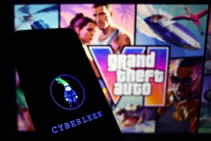 GTA IV website displayed on a laptop screen and Cyberleek logo displayed on a phone screen