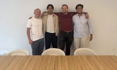 Evos founder and CEO Urav Shah with the company’s first three employees during an onsite visit.