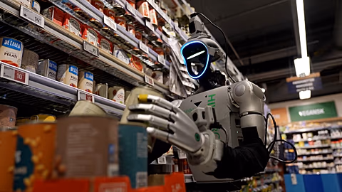  Hive Robots humanoid robot stacking shelves at Føtex grocery store