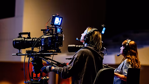 Production crew operating a camera rig