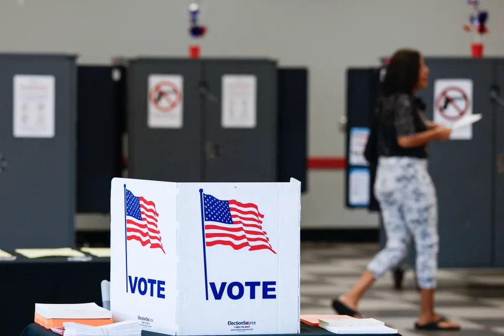 A person votes at a polling location during early voting.