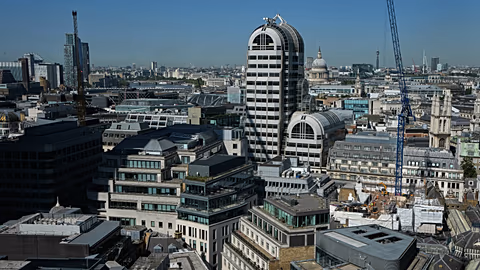 FILE - A view across the city towards St Pauls Cathedral in London
