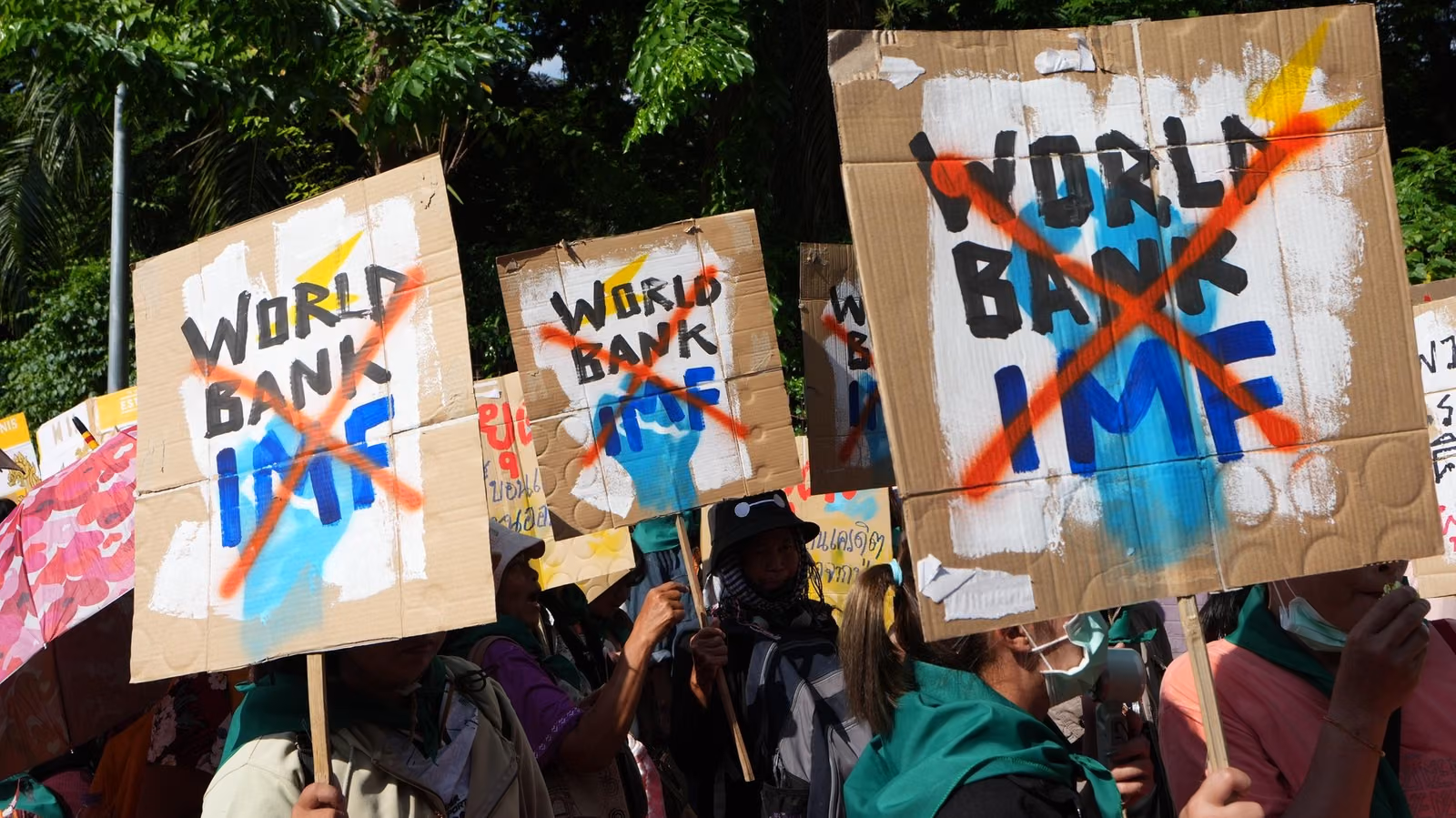 Protesters march to a meeting venue during a demonstration against...