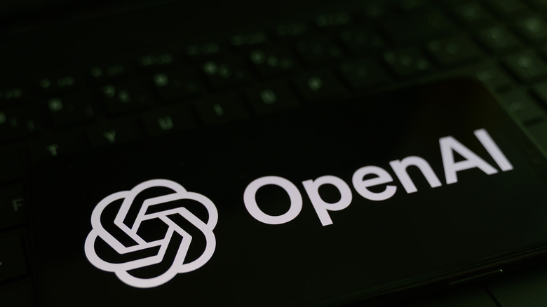 OpenAI logo against a keyboard