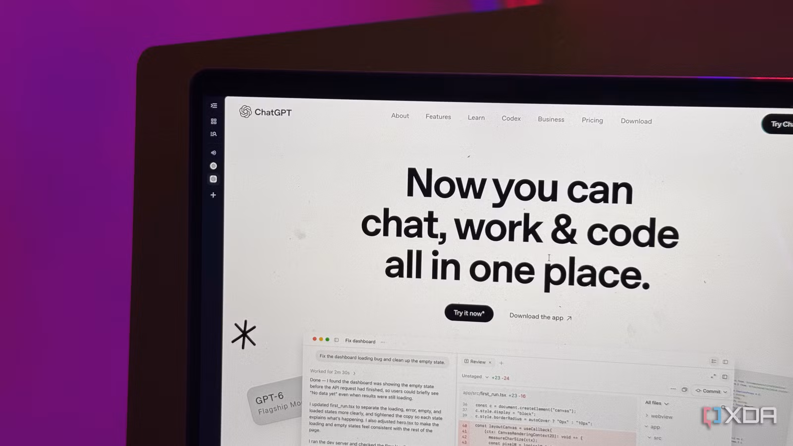 Close-up of ChatGPT's homepage headline on a MacBook, with a coding demo below