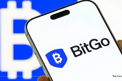 BitGo logo displayed on a smartphone screen set against a blue and white Bitcoin background.